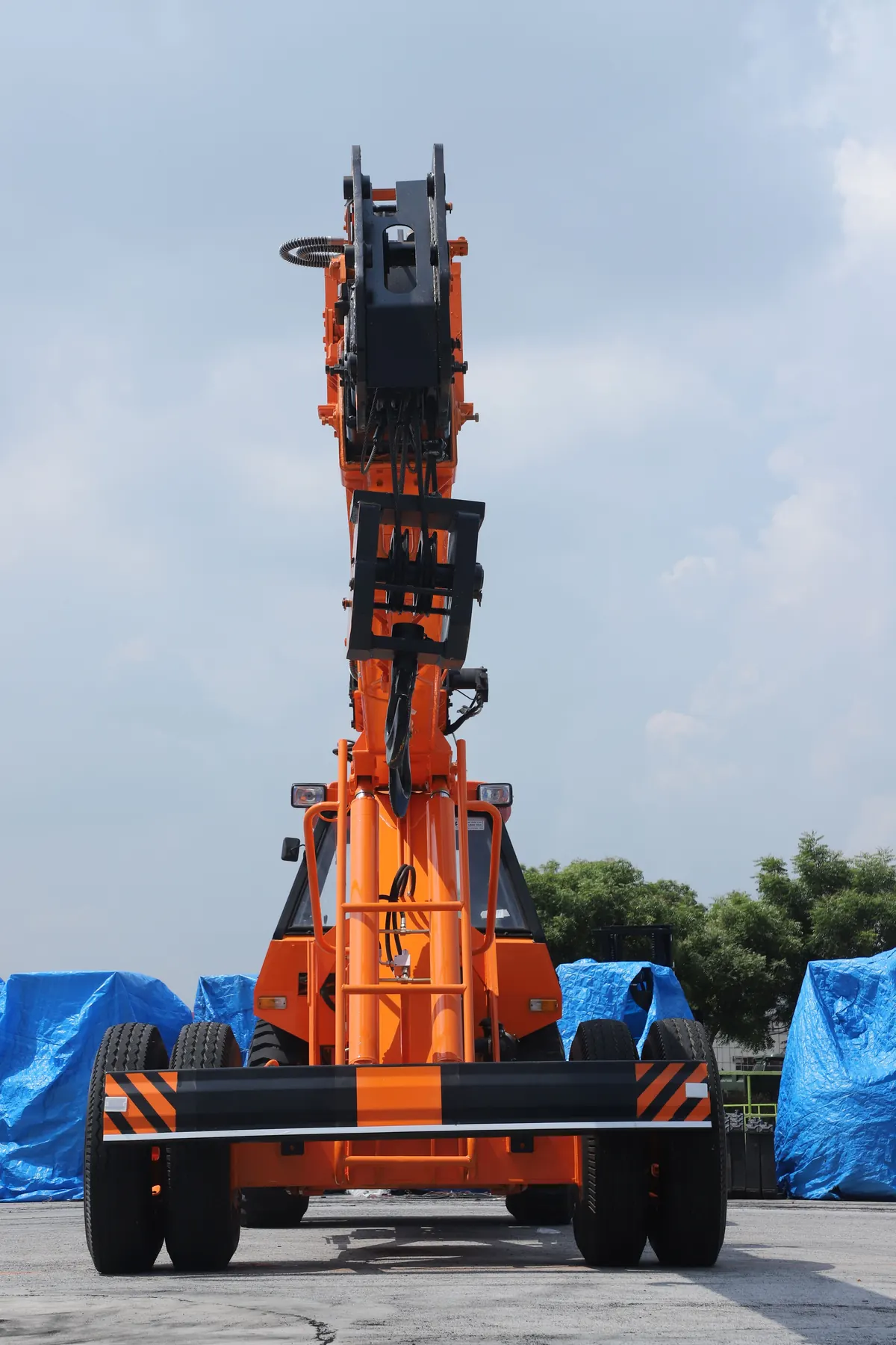 Orange mobile crane photographed at a construction site